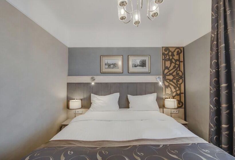 Quarto deluxe, Metropole Hotel By Semarah