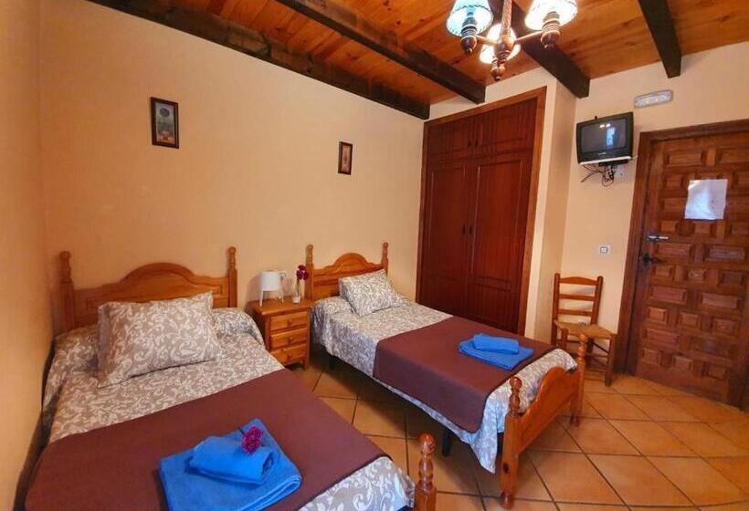 舒适三人间, Pensión El Barrio