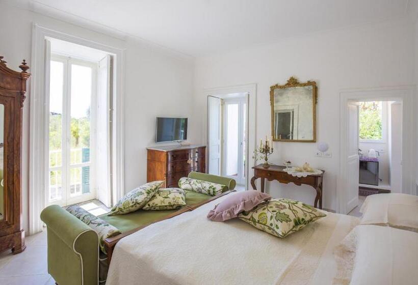 חדר סטנדרט לשלושה עם נוף לגינה, Palazzo Cacace Relais