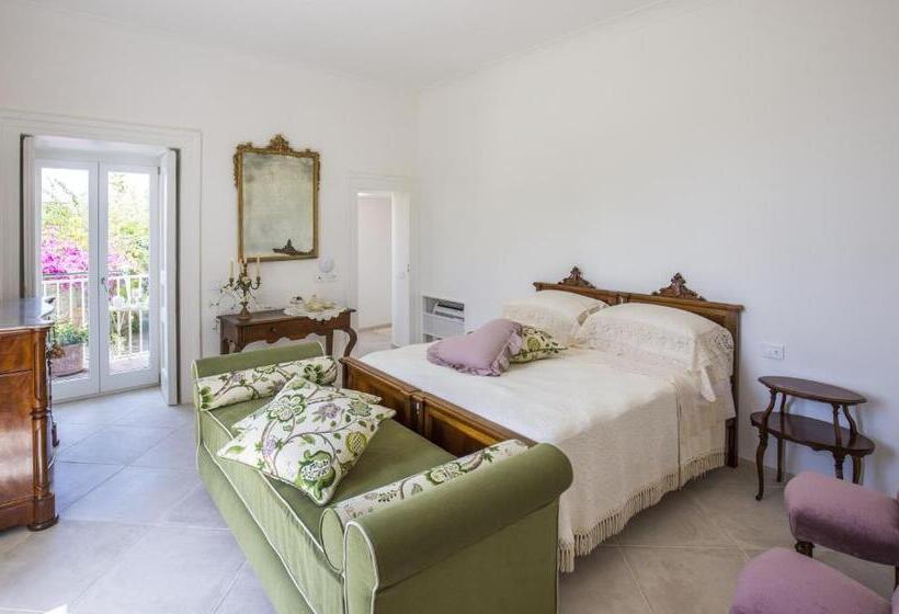 חדר סטנדרט לשלושה עם נוף לגינה, Palazzo Cacace Relais