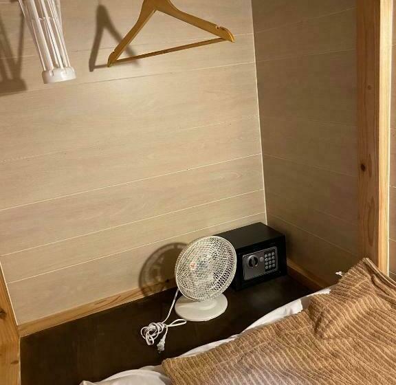 سرير فى غرفة مشتركه, ゲストハウス喜舎場