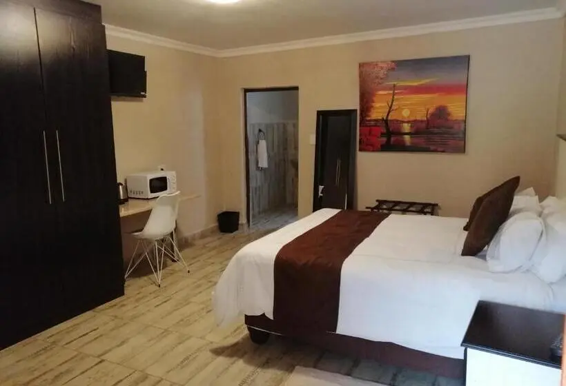 キングサイズベッドのデラックスルーム, Kanyane Lodge