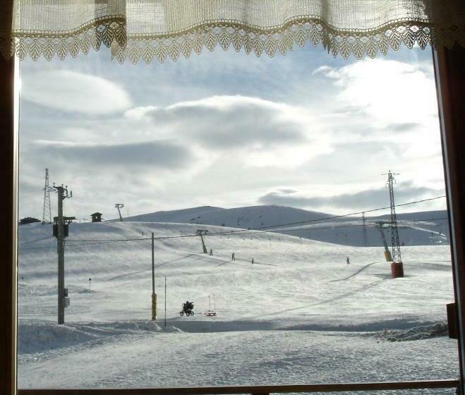 Quarto standart com varanda, Sciatori