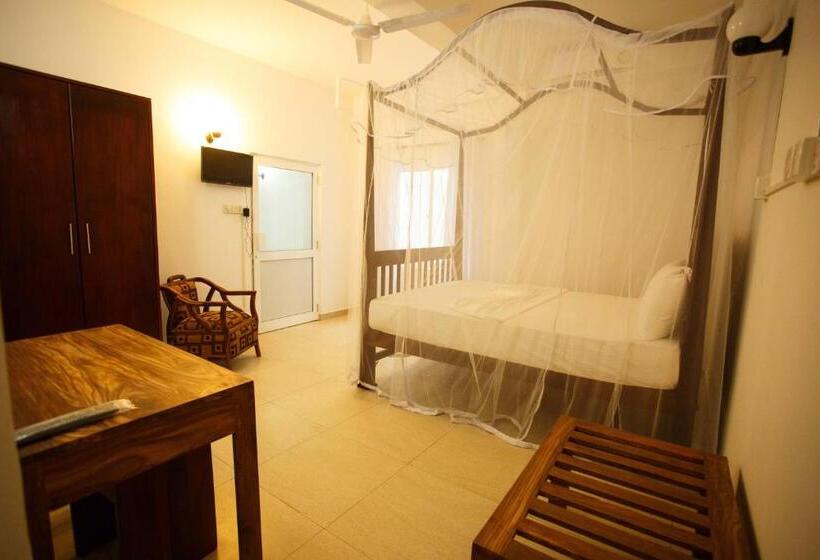 Camera Quadrupla Standard Vista Giardino, Tharanga Surfing Villa