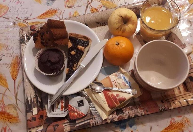 غرفة قياسية رباعية مزودة بشُرفة, La Casa Dei Nonni B&b