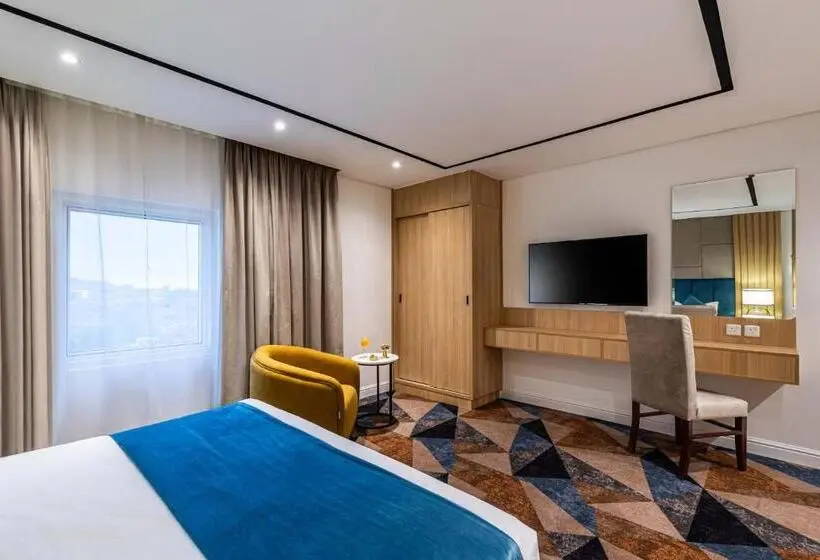 キングサイズベッドのデラックスルーム, Al Qasr Hotel   Al Rabwa