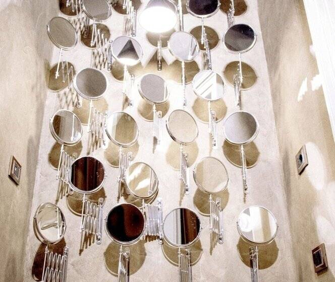 اتاق لوکس, Asmundo Di Gisira