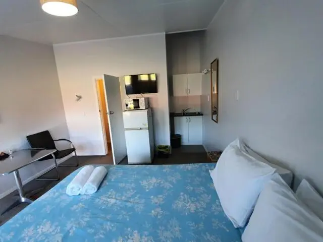 キングサイズベッドのデラックススイート, Oasis Motel & Holiday Park Turangi