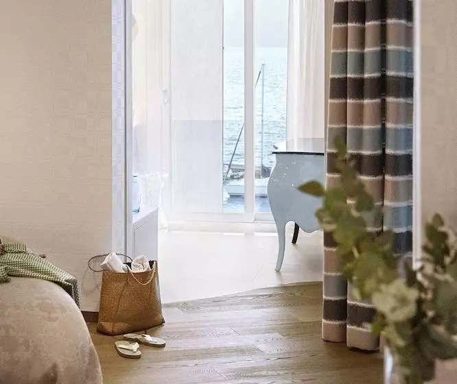 Superior suite with lake view, Eden Roc   The Leading Hotels Of The World
