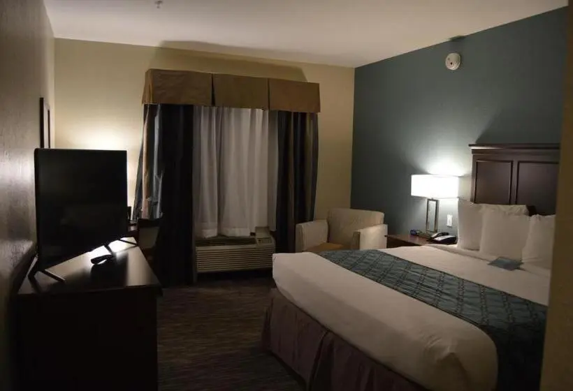 キングサイズベッドのスタンダードルーム, Heritage Place Hotel And Suites