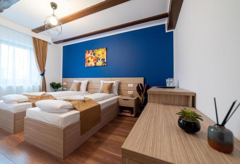 חדר דלוקס, Escala Rooms