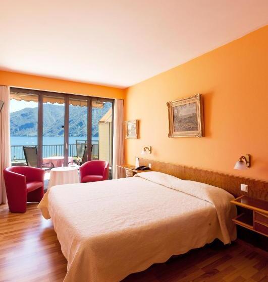 Superior room with lake view, Swiss Lodge Nassa Garni