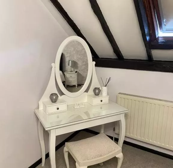 Deluxe-sviitti, Coach House