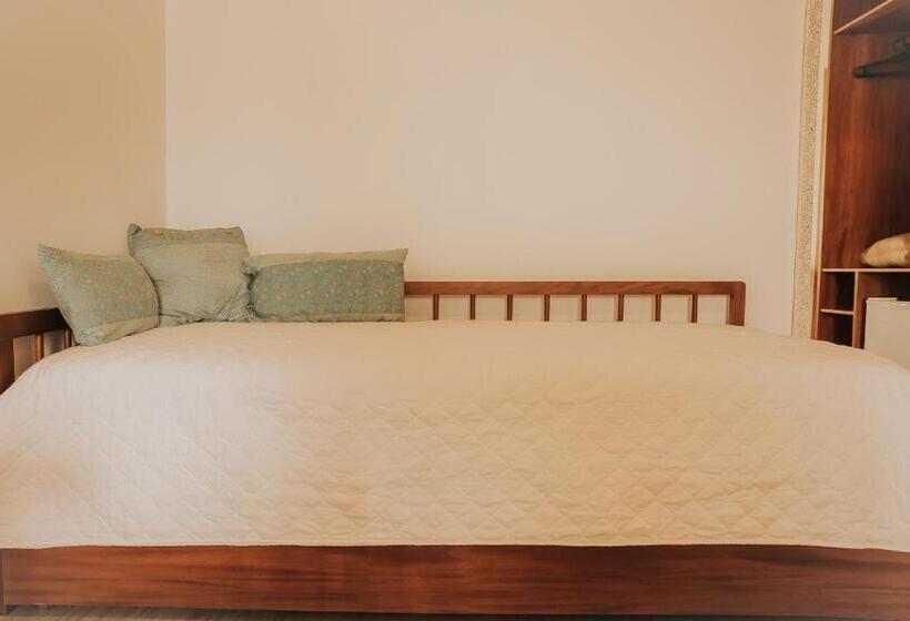 اتاق خانوادگی با چشم‌انداز باغ, Pousada Cheiro Da Terra