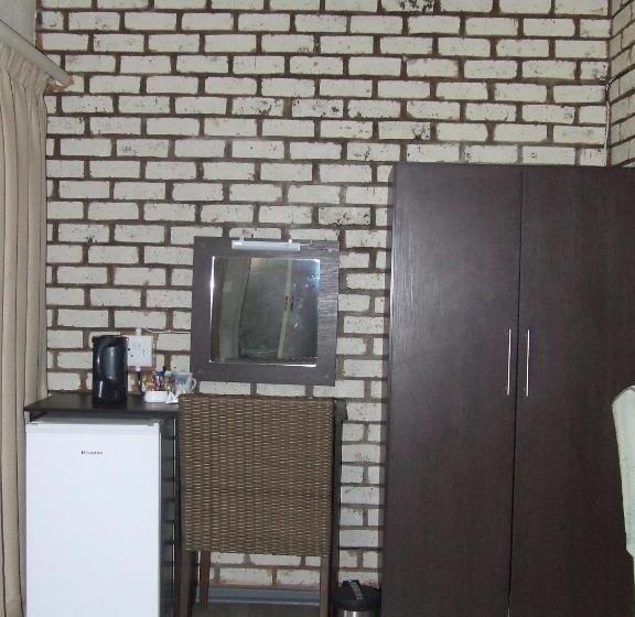 キングサイズベッドのデラックススイート, Kruger S Guest House