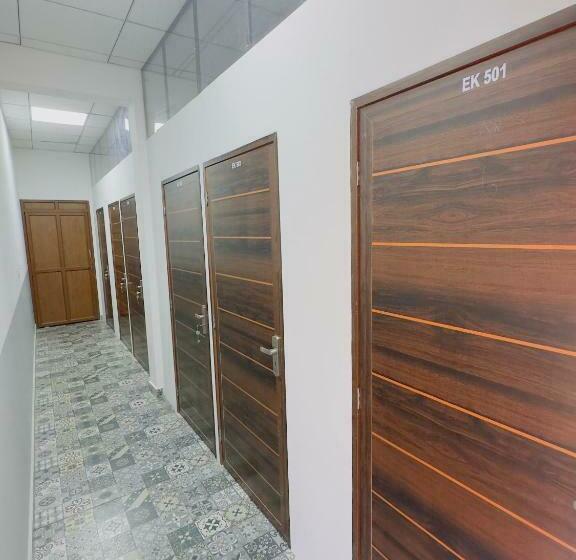 سرير فى غرفة مشتركه, Tcs Rooms Ezhilode Payyanur