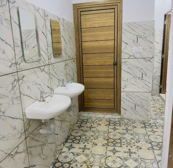 سرير فى غرفة مشتركه, Tcs Rooms Ezhilode Payyanur